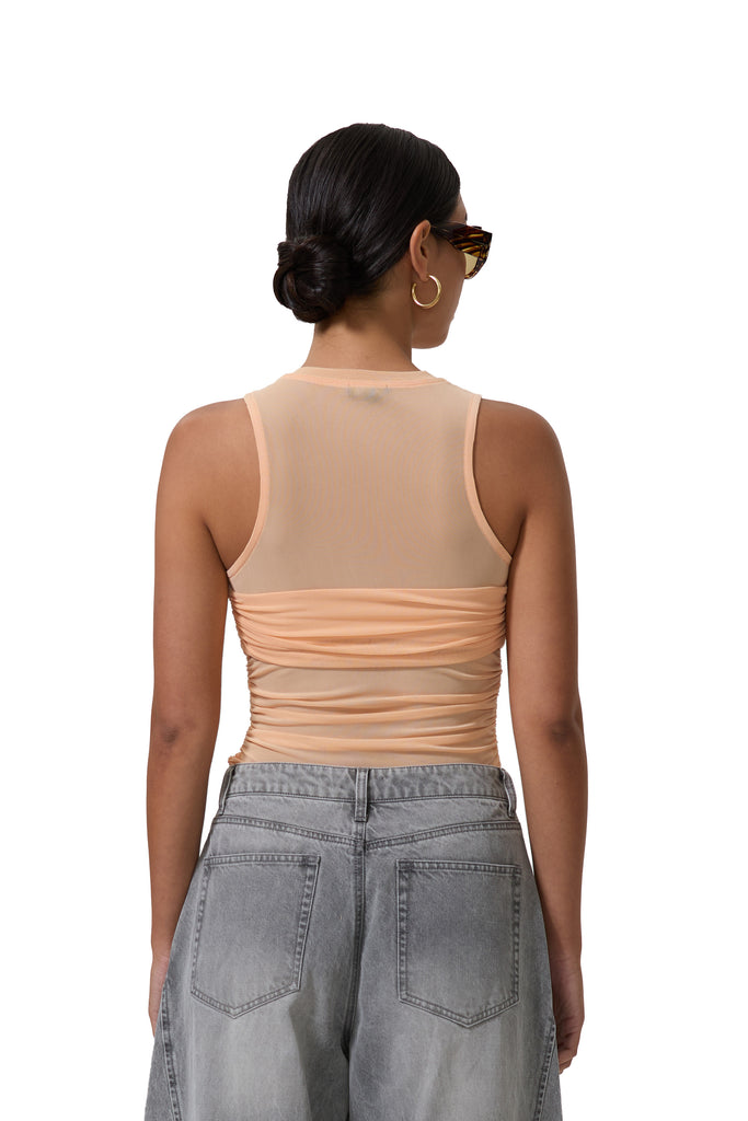 women's sleeveless top with illusion bandeau detail in peach fuzz