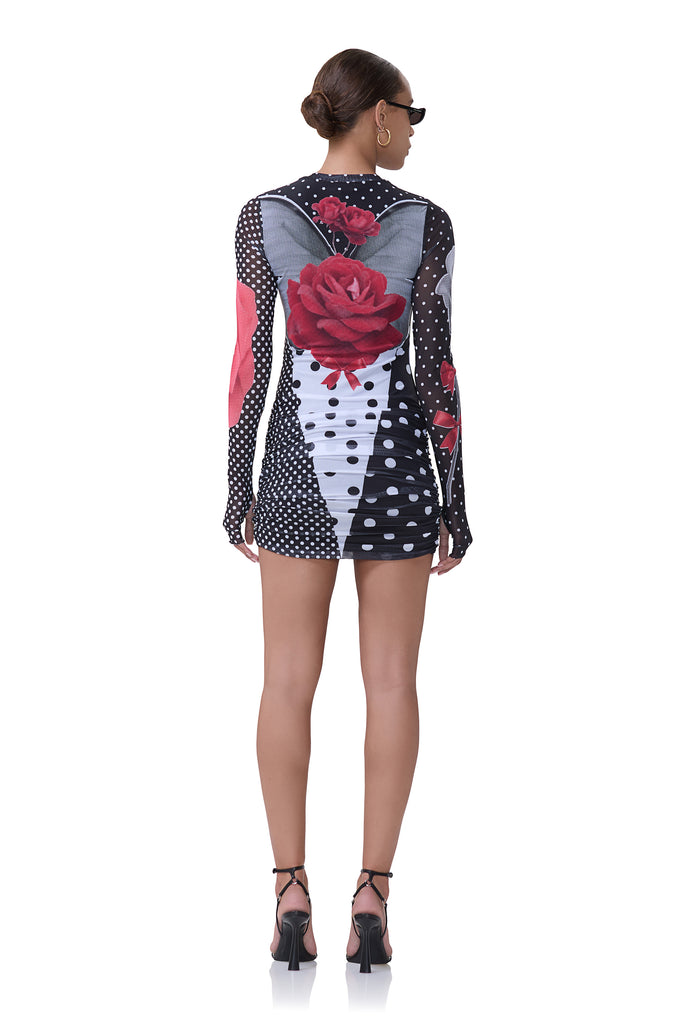 women's crew neck mesh mini dress with a drop waist detail and front ruching in smile dot print